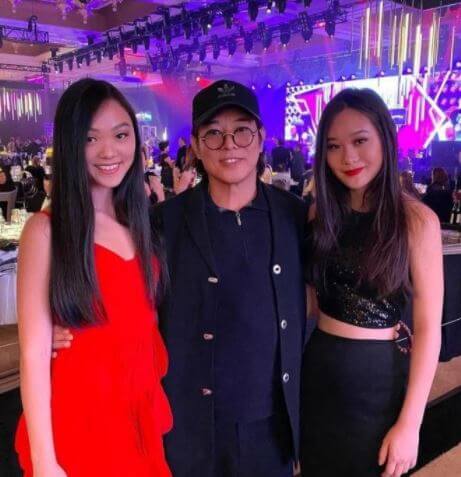 Nina Li Chi daughters Jane in a red dress and Jade in Black and her husband Jet Li.